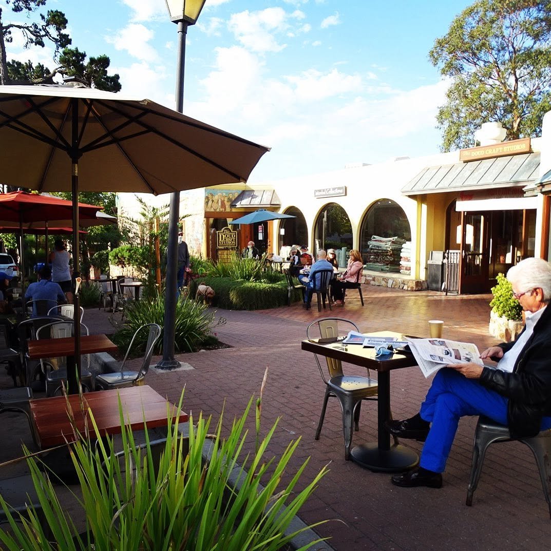 Carmel Belle's sun-dappled courtyard patio at Doud Craft Studios